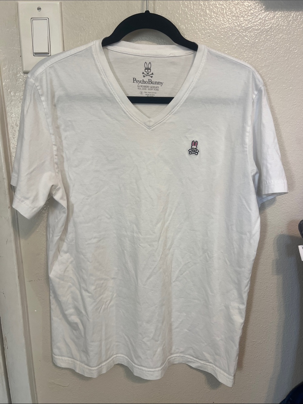 Psycho Bunny Men’s White V-Neck Tee with Pink Logo